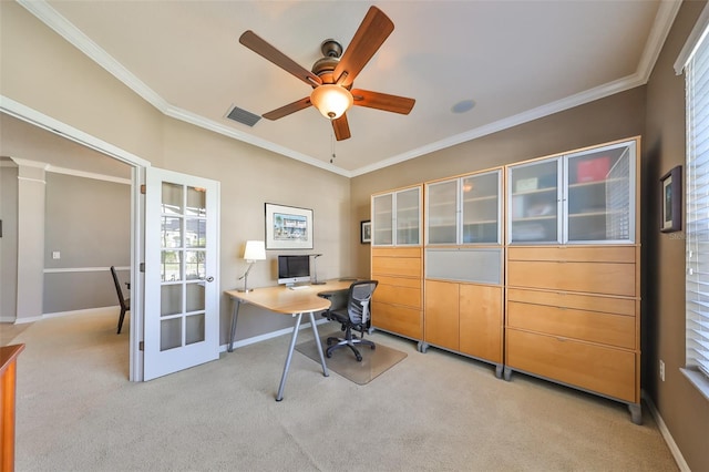 carpeted home office featuring plenty of natural light, ceiling fan, crown molding, and decorative columns