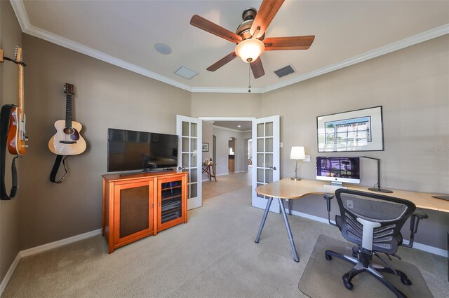 carpeted office space featuring french doors, ceiling fan, and crown molding