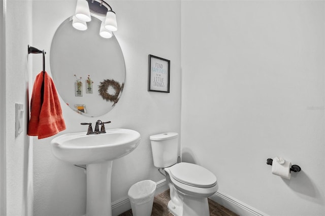 19915 Gulf Blvd Unit 805, Indian Shores, FL 33785 - half bathroom with wood finished floors and toilet