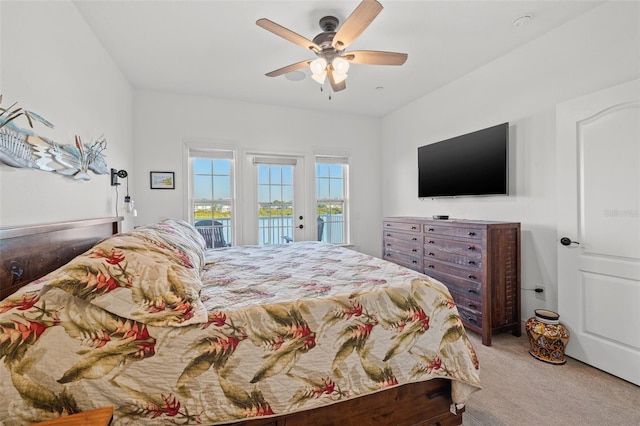 bedroom with ceiling fan, carpet floors, and access to outside