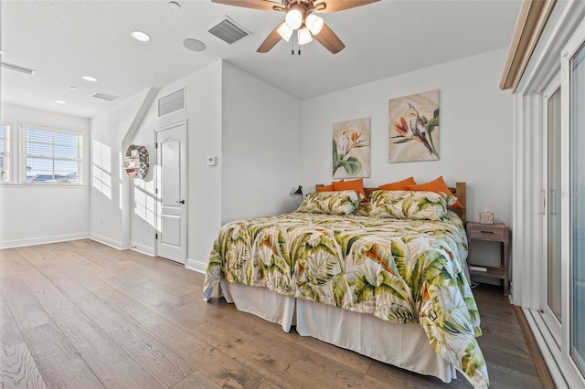 bedroom featuring wood-type flooring and ceiling fan