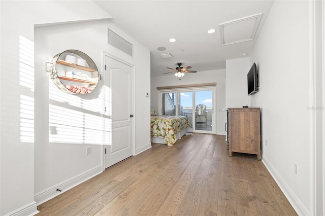 entrance foyer with ceiling fan and light wood-type flooring