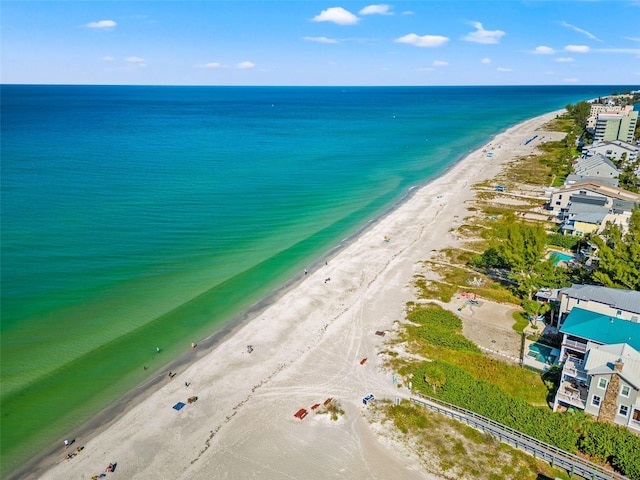 aerial view featuring a view of the beach and a water view