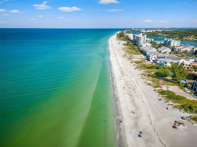 bird's eye view with a view of the beach and a water view