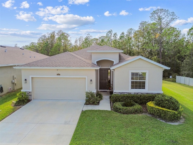 view of front facade featuring a front yard and a garage