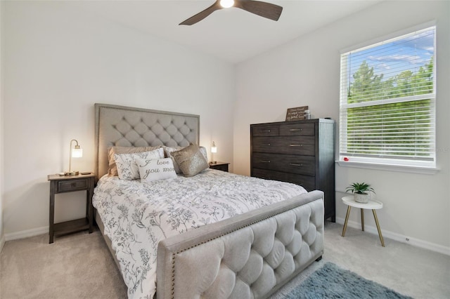 bedroom with light colored carpet and ceiling fan