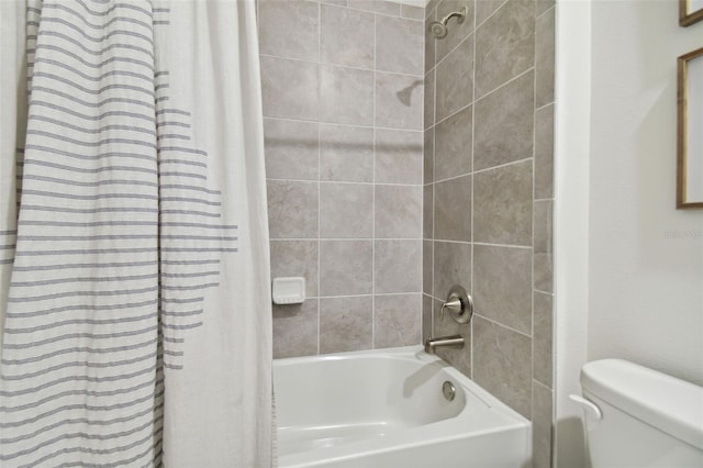 bathroom with toilet and shower / tub combo with curtain