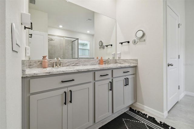 bathroom featuring vanity and an enclosed shower