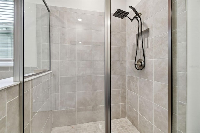 bathroom with a tile shower