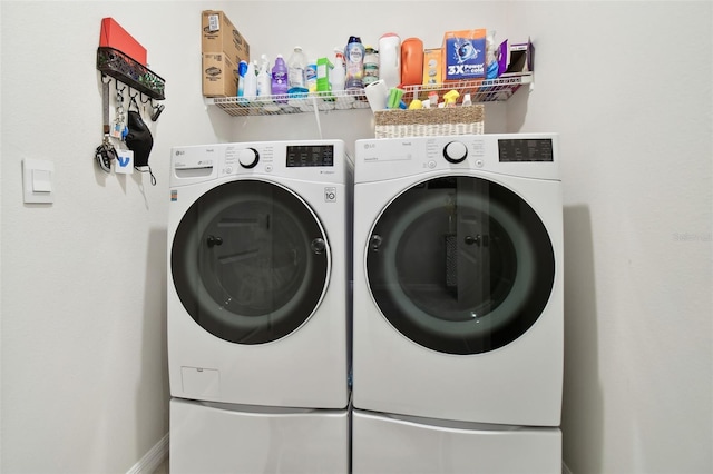 laundry room featuring separate washer and dryer