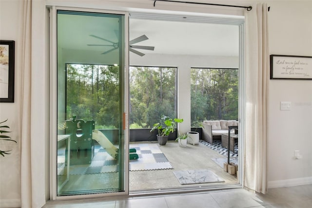 doorway to outside featuring light tile patterned flooring