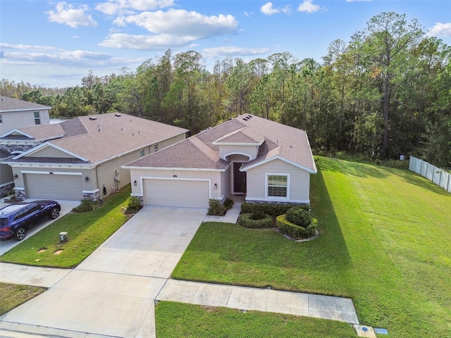 view of front facade featuring a garage and a front lawn