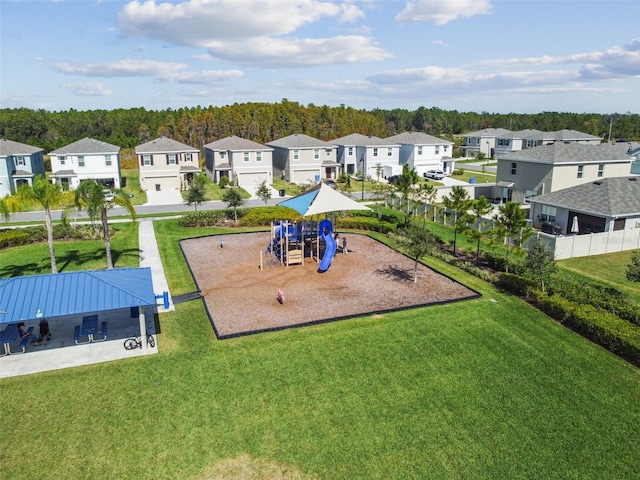 exterior space with a lawn and a playground