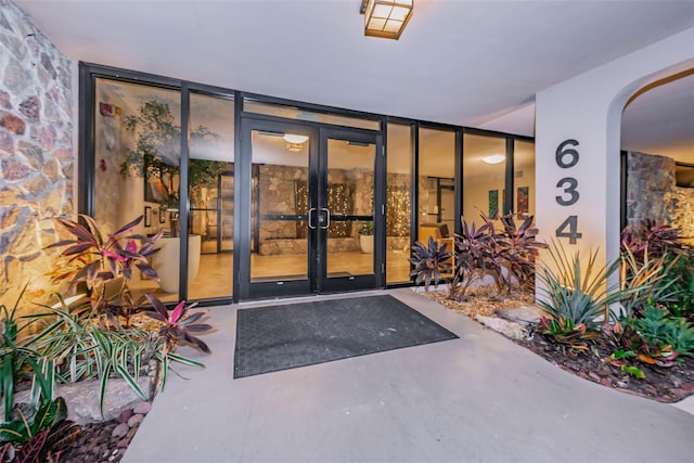 entrance to property featuring french doors