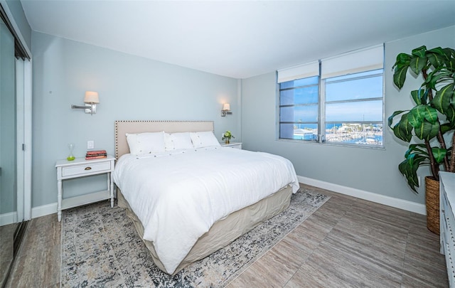 bedroom with hardwood / wood-style flooring