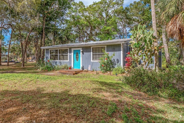 ranch-style house with a front lawn