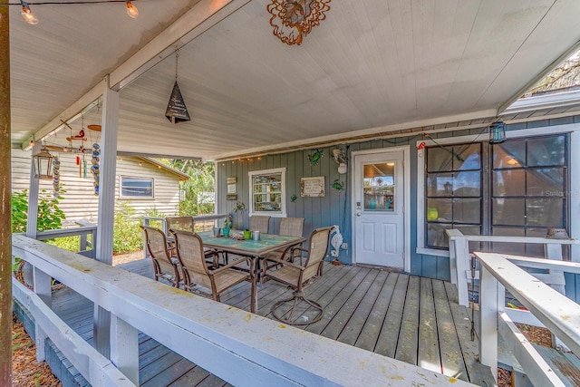 wooden terrace featuring covered porch