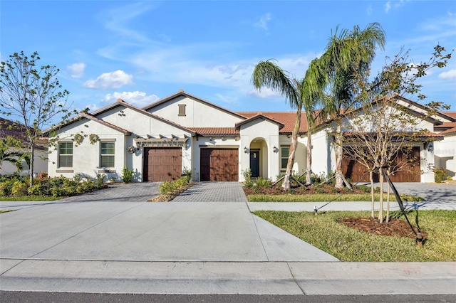 mediterranean / spanish-style house featuring a garage