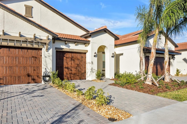 view of front of property with a garage