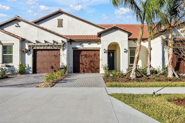 mediterranean / spanish-style house featuring a garage