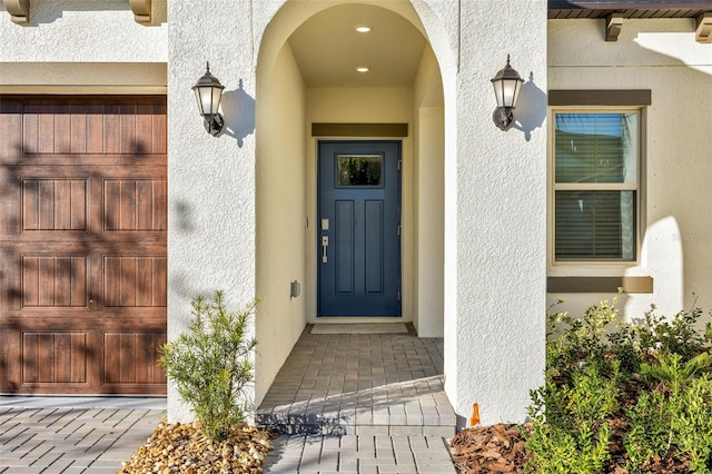 entrance to property featuring a garage