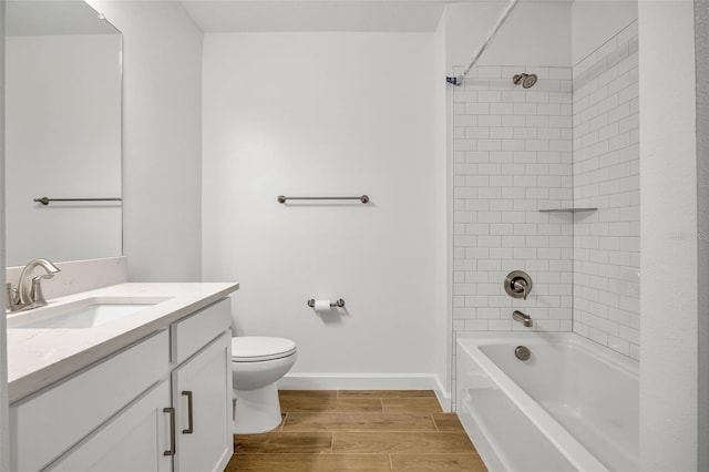 full bathroom featuring vanity, toilet, and tiled shower / bath