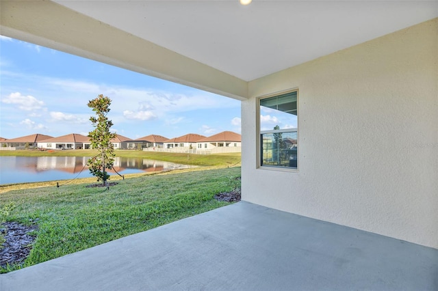 view of patio / terrace with a water view