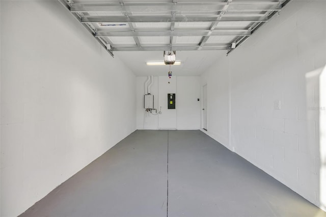 garage with a garage door opener and electric panel