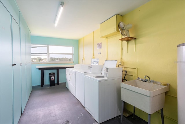 laundry area featuring independent washer and dryer and sink