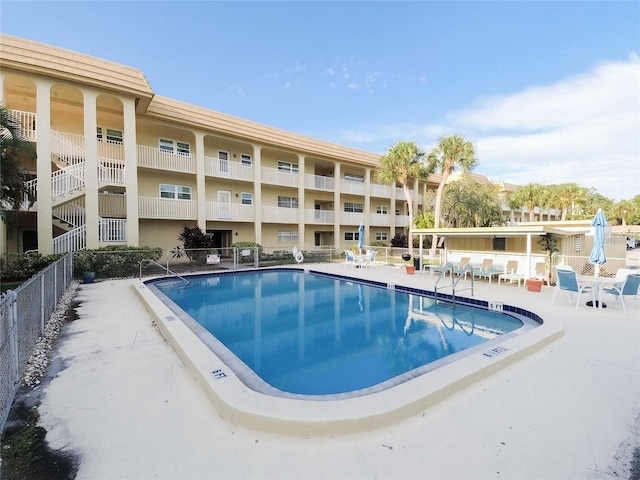 view of swimming pool featuring a patio area