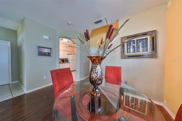 dining area with hardwood / wood-style floors