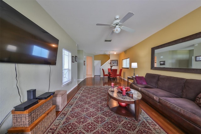 living room with hardwood / wood-style floors and ceiling fan