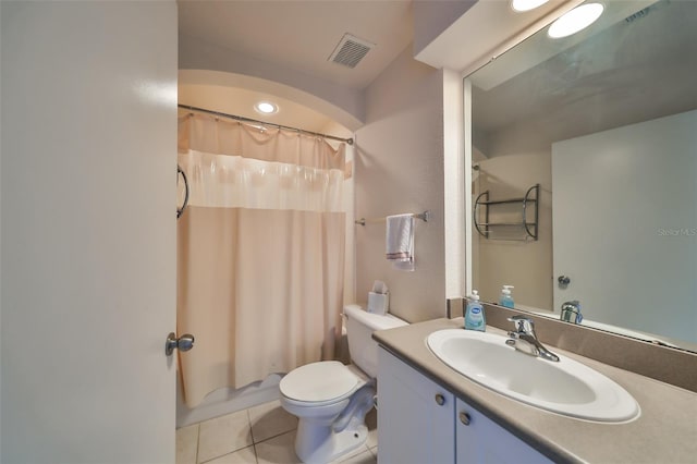 full bathroom featuring tile patterned flooring, vanity, toilet, and shower / bathtub combination with curtain