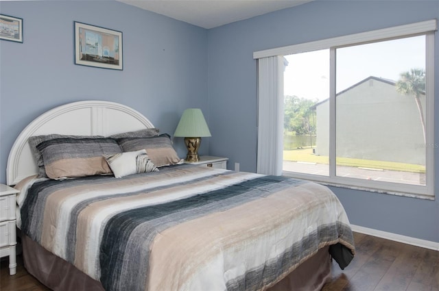 bedroom featuring dark hardwood / wood-style flooring