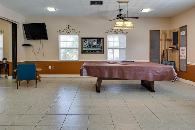 rec room with ceiling fan, light tile patterned floors, a healthy amount of sunlight, and pool table