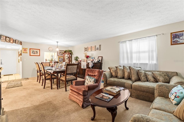 living room with a textured ceiling and light carpet