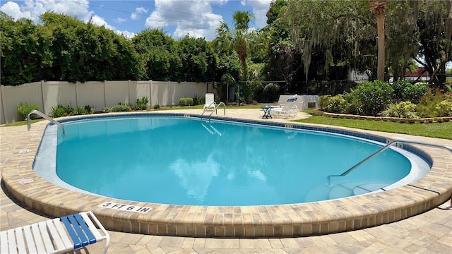 view of pool featuring a patio area