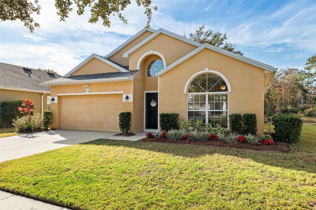 view of front facade with a front lawn and a garage