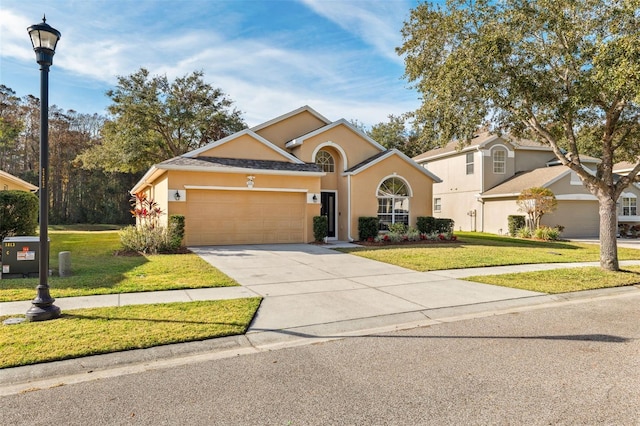 view of front of house featuring a front yard and a garage