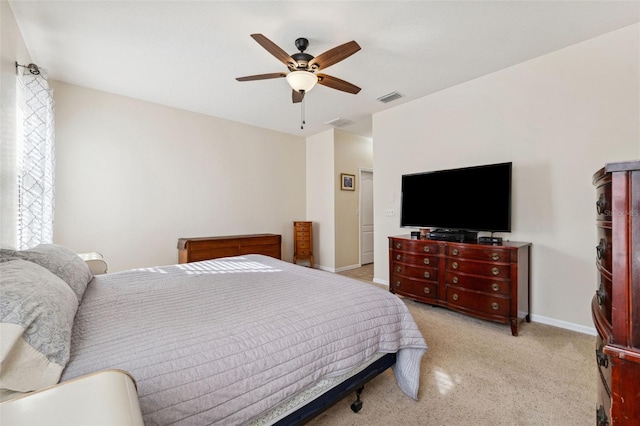 bedroom featuring ceiling fan and light carpet