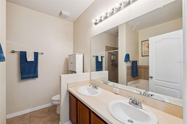 full bathroom featuring tile patterned floors, a textured ceiling, toilet, vanity, and shower with separate bathtub