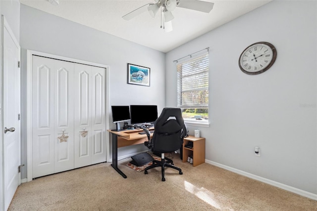 office area featuring ceiling fan and light colored carpet