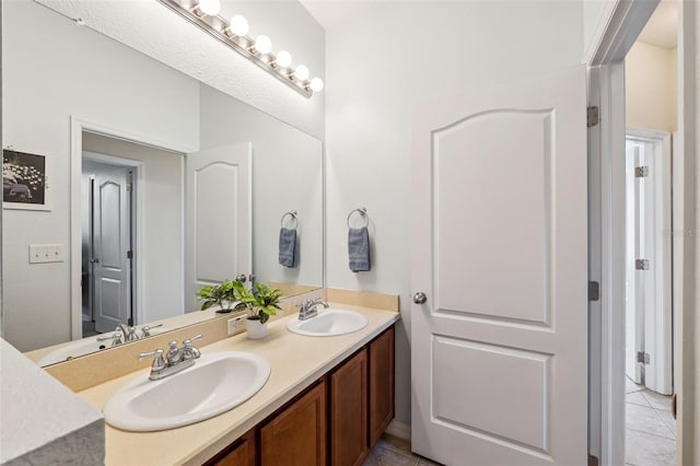 bathroom with vanity and tile patterned floors