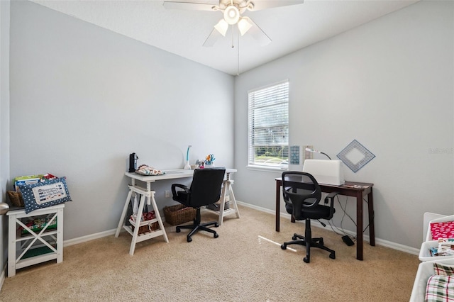 office space with light carpet and ceiling fan