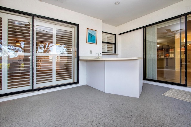 interior space with carpet and sink