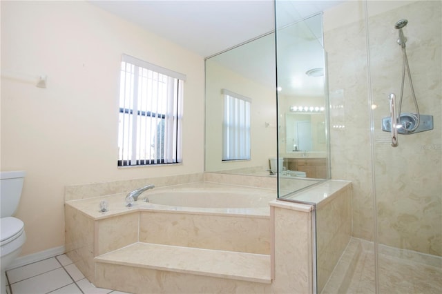 bathroom featuring tile patterned floors, toilet, and shower with separate bathtub