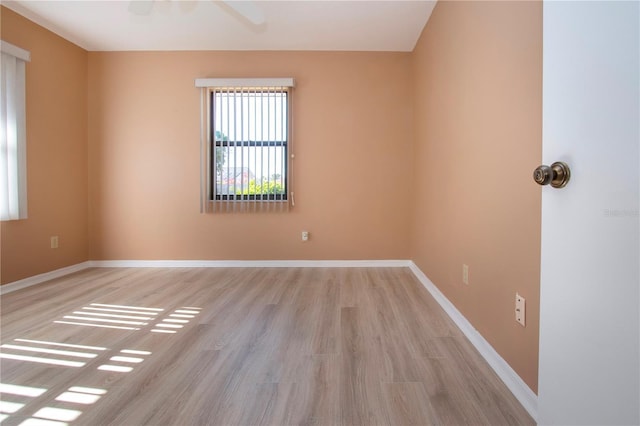 spare room featuring light wood-type flooring