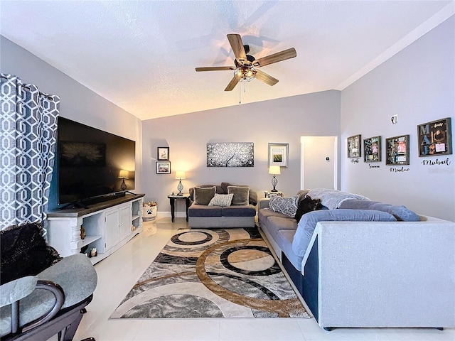 living room featuring a textured ceiling, ceiling fan, lofted ceiling, and light tile patterned flooring