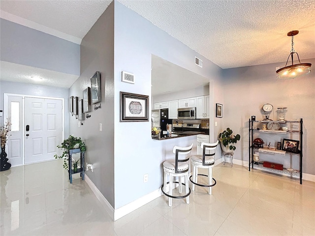 interior space with a textured ceiling