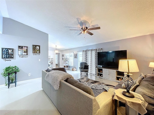 living room featuring ceiling fan, a textured ceiling, and vaulted ceiling